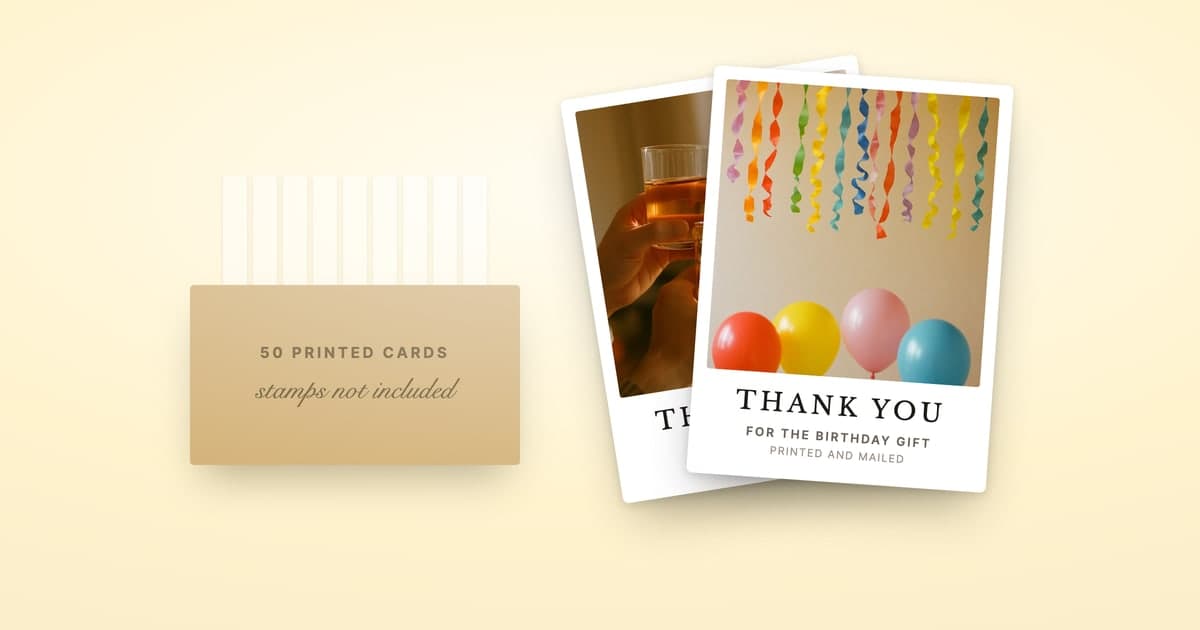 ShipNote postcards fanned beside a box of self-printed cards waiting to be stamped